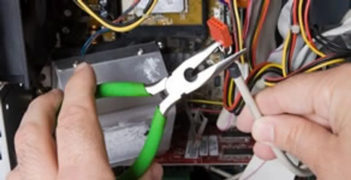 Licensed electrical contractor performing electrical repair with tools in Berkeley, CA