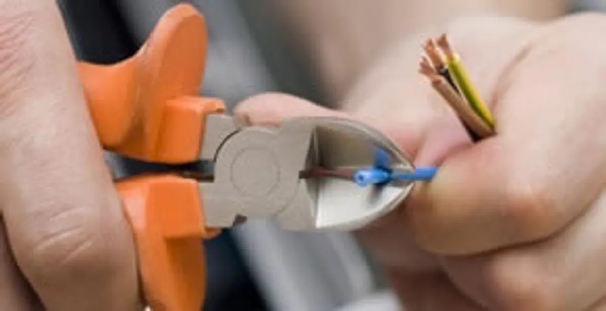 professional electrical services showing precise wire cutting by licensed electricians in San Francisco, CA